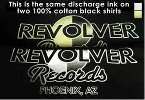 Two 100% cotton black shirts printed with white discharge ink. One has a yellow hue, the other is white. Both were printed with the same ink.